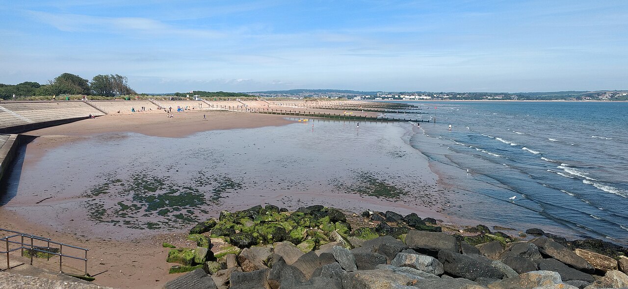 A wide view across the sandy beach and sea at Dawlish Warren